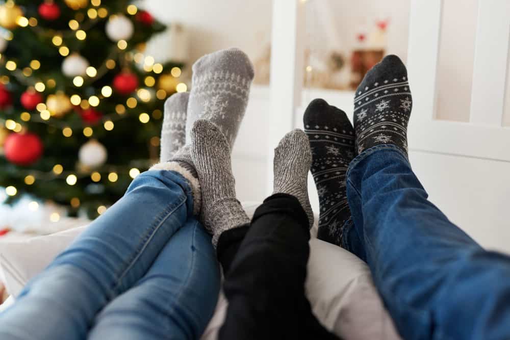 close-up-family-s-legs-warm-socks