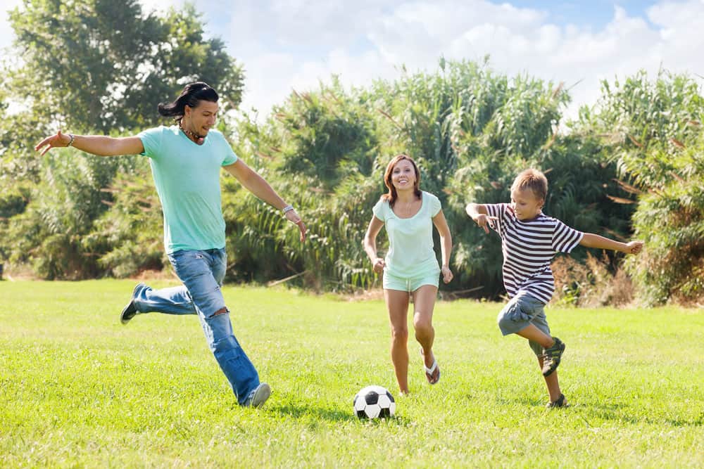 family-with-teenager-playing-soccer