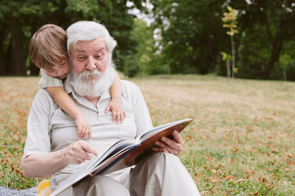 grandpa reading with grandchild