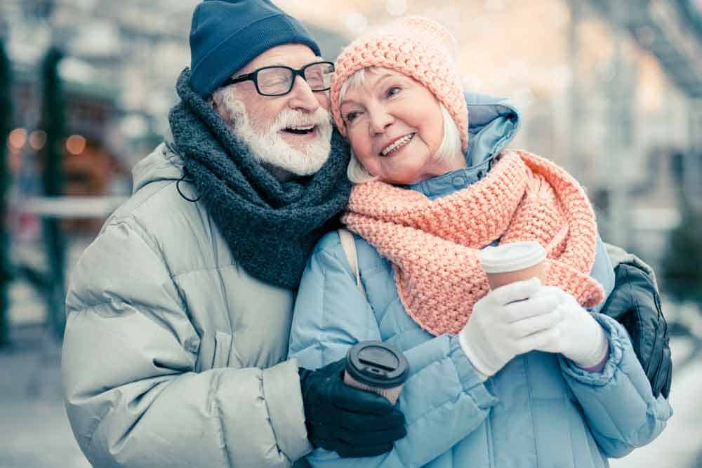 senior couple hugging in cold weather