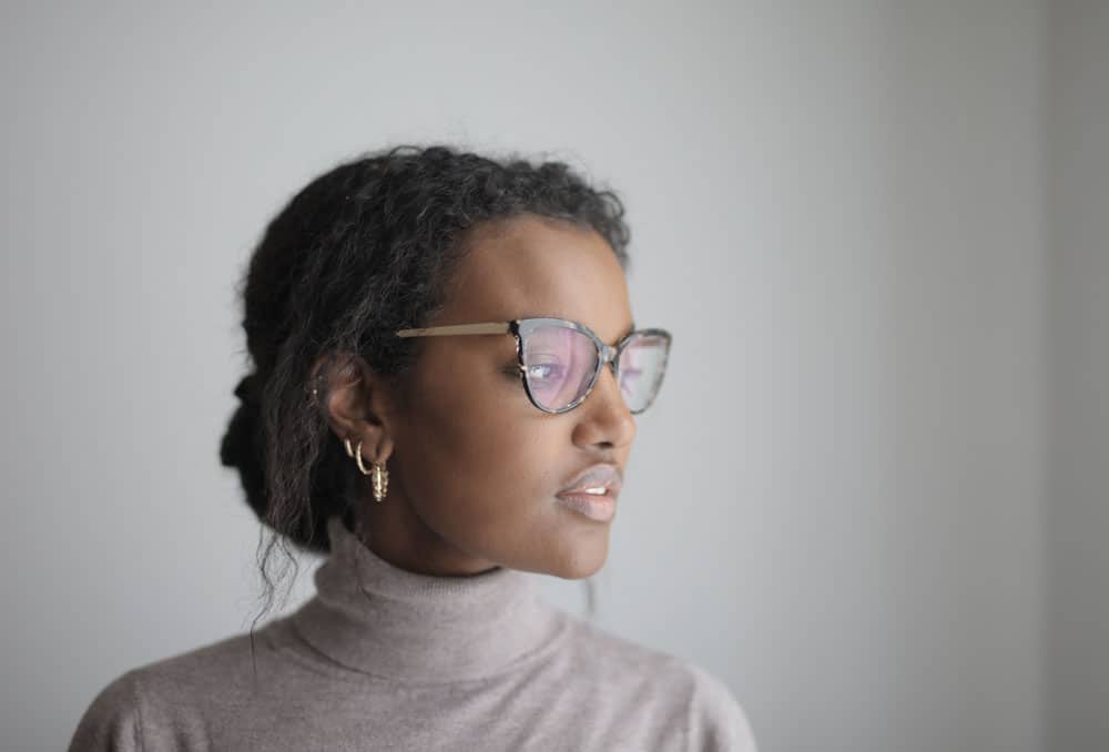 shallow-focus-african-american-female-with-glasses-wearing-gray-turtleneck