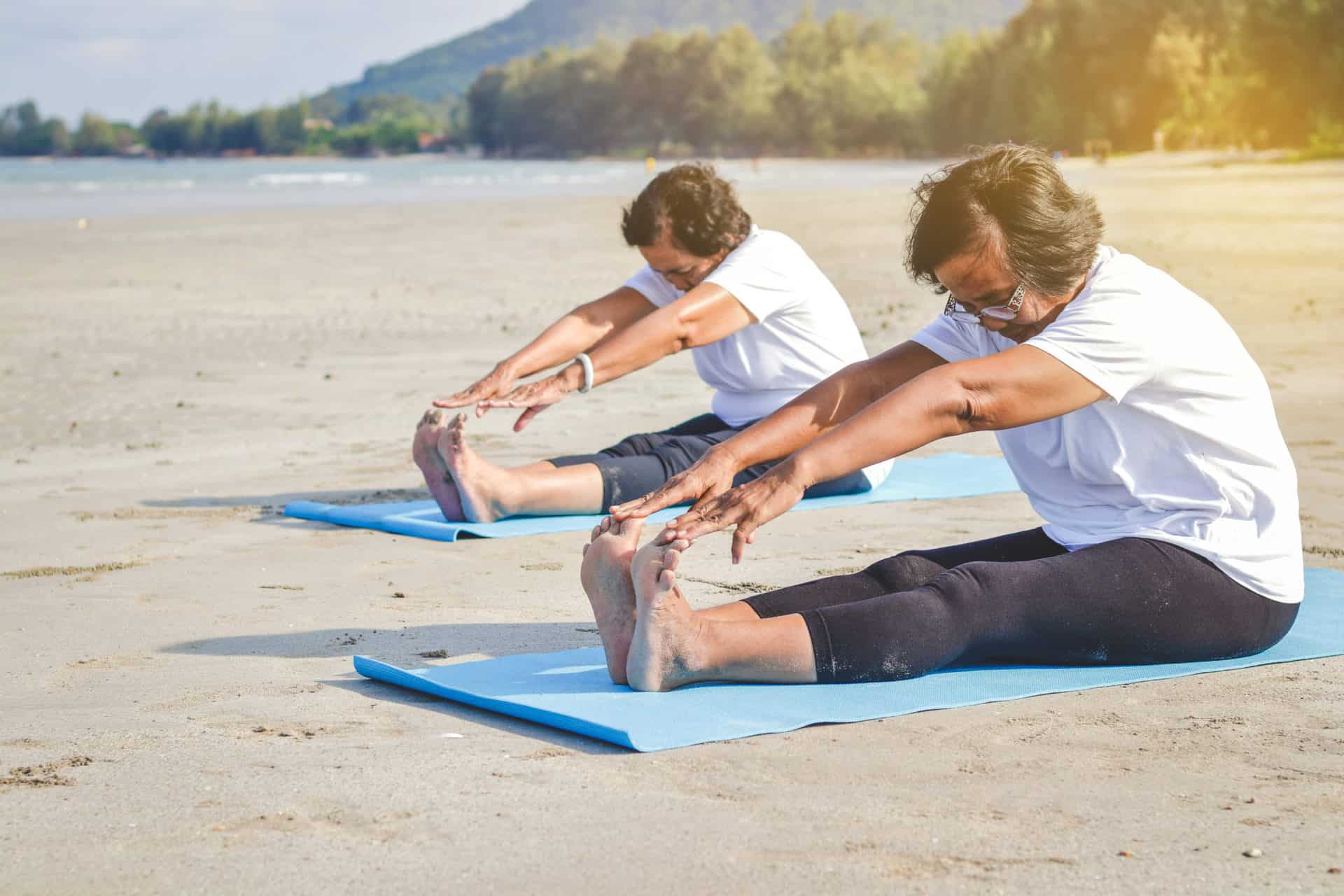 Elderly women exercising at the beach by the sea Fresh air, strong body