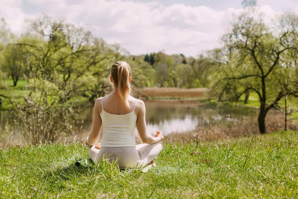 woman-meditating-in-park