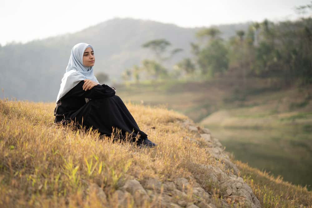 woman-with-hijab-sitting-outdoor