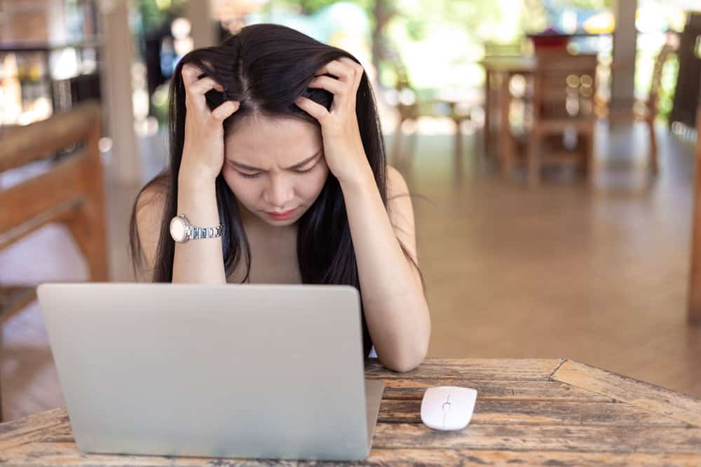 young-woman-working-laptop-having-headache