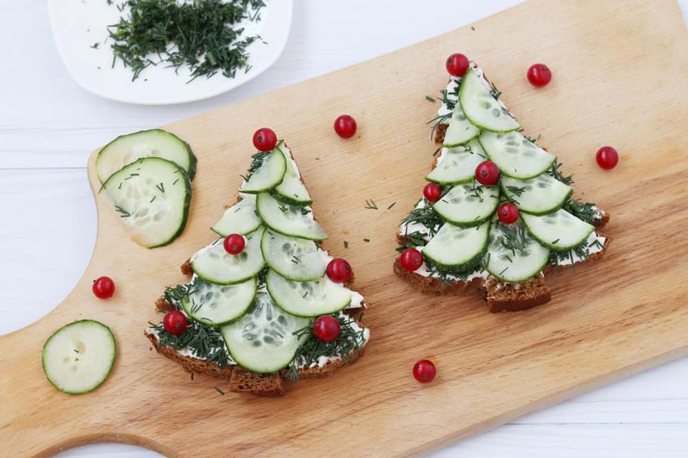 sandwiches-made-black-bread-cheese-cucumber-form-christmas-tree-decorated-with-berries