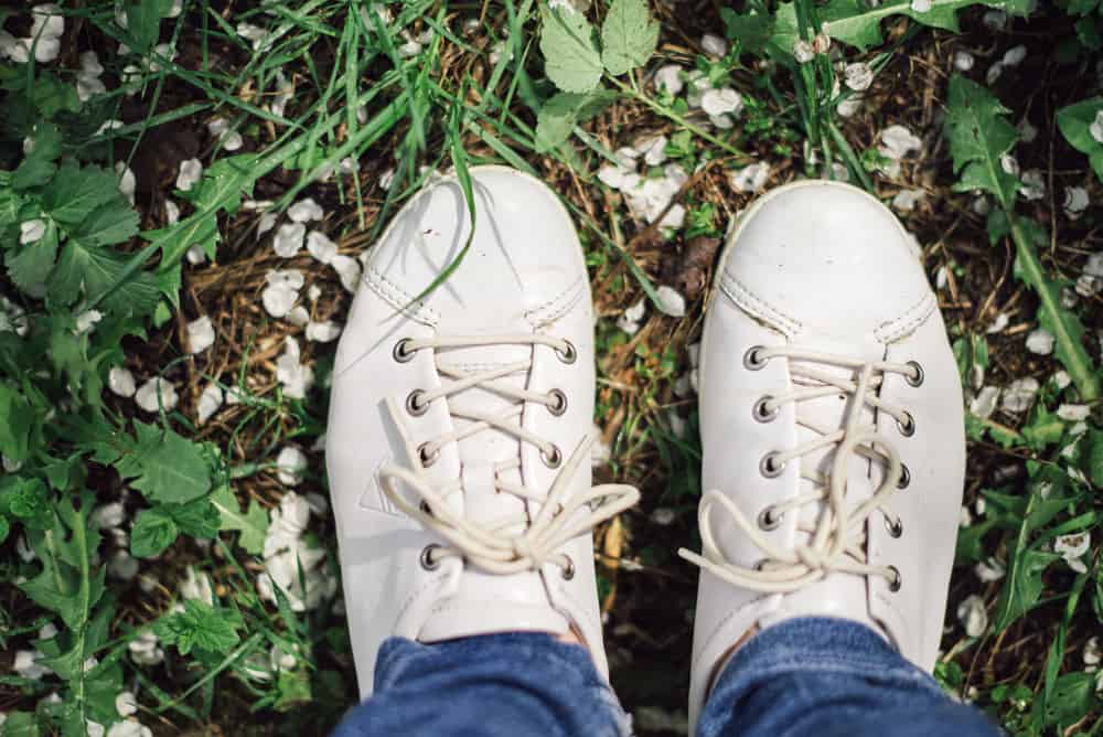 pair-white-shoes-green-grass
