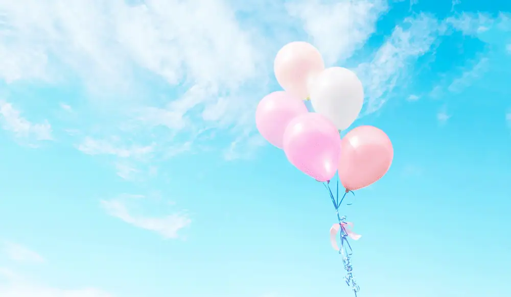 balloons floating in sky