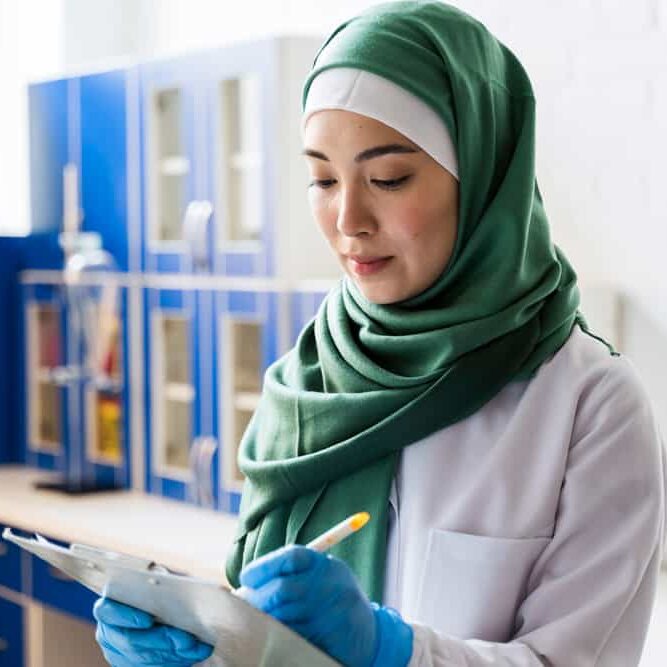 side-view-female-scientist-with-hijab-notepad