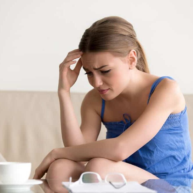 woman-feeling-upset-because-loan-debt-letter