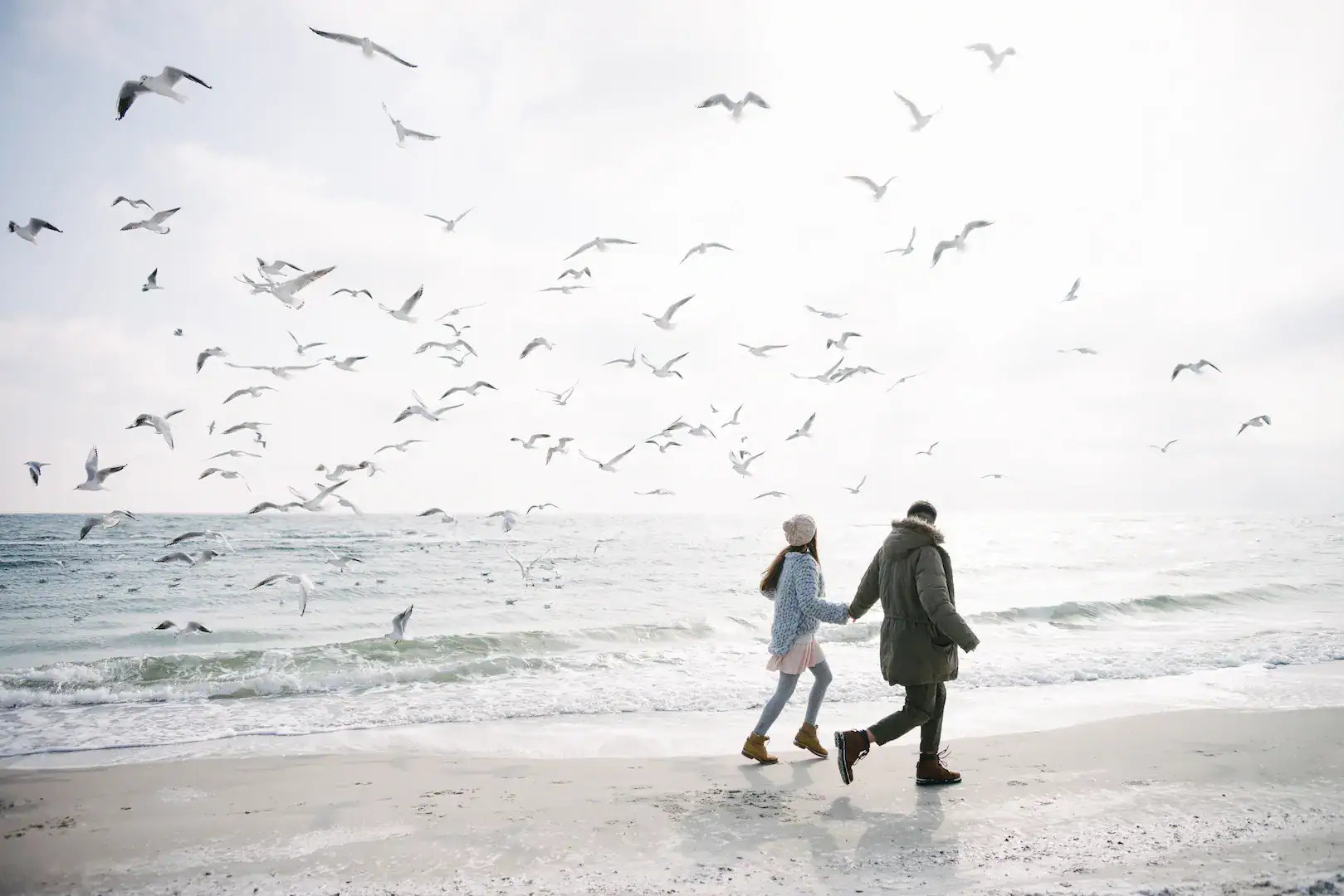 young couple holding hands and walking on winter s 2022 12 16 20 14 04 utc